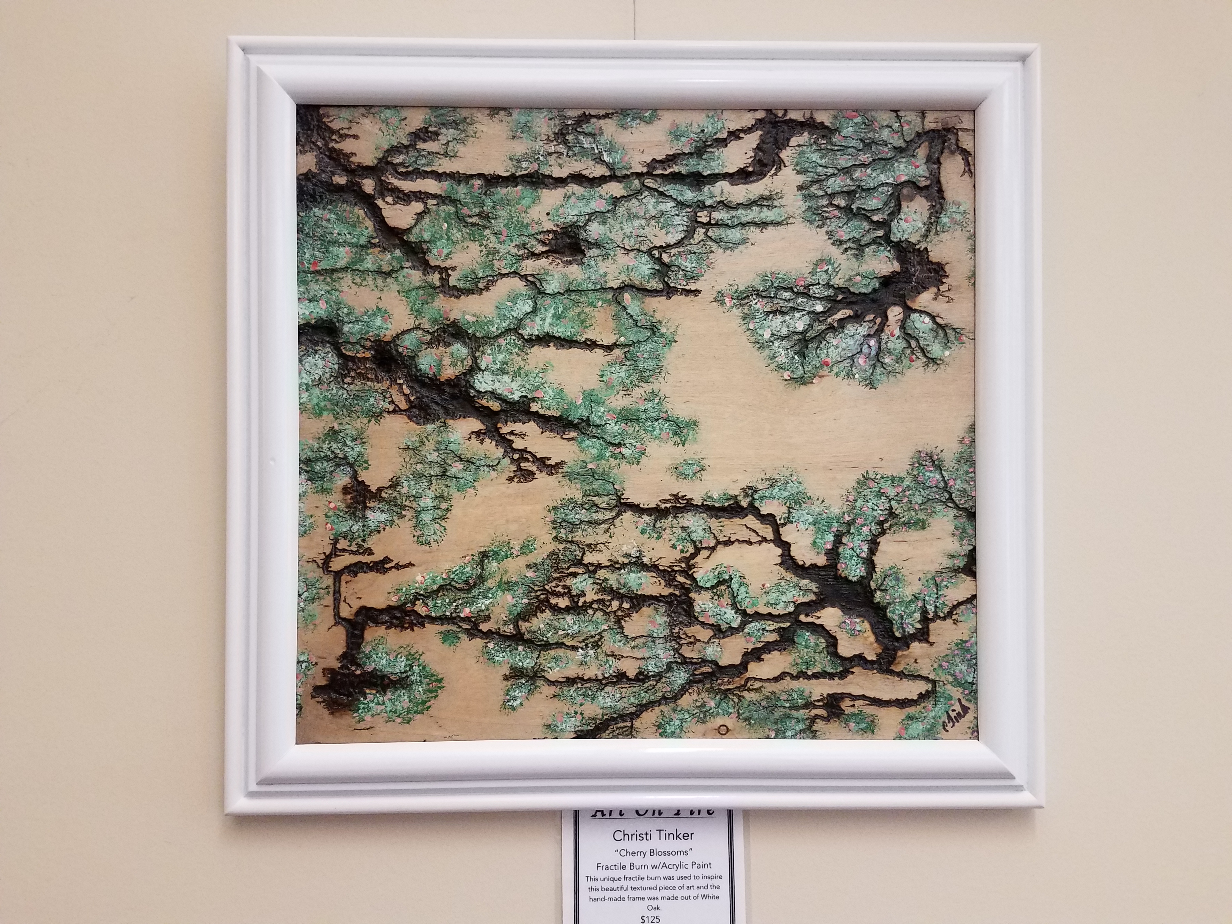 Christi Tinker’s “Cherry Blossoms” is on display for the USM Gulf Coast Library’s “Art on Fire” exhibit. 
