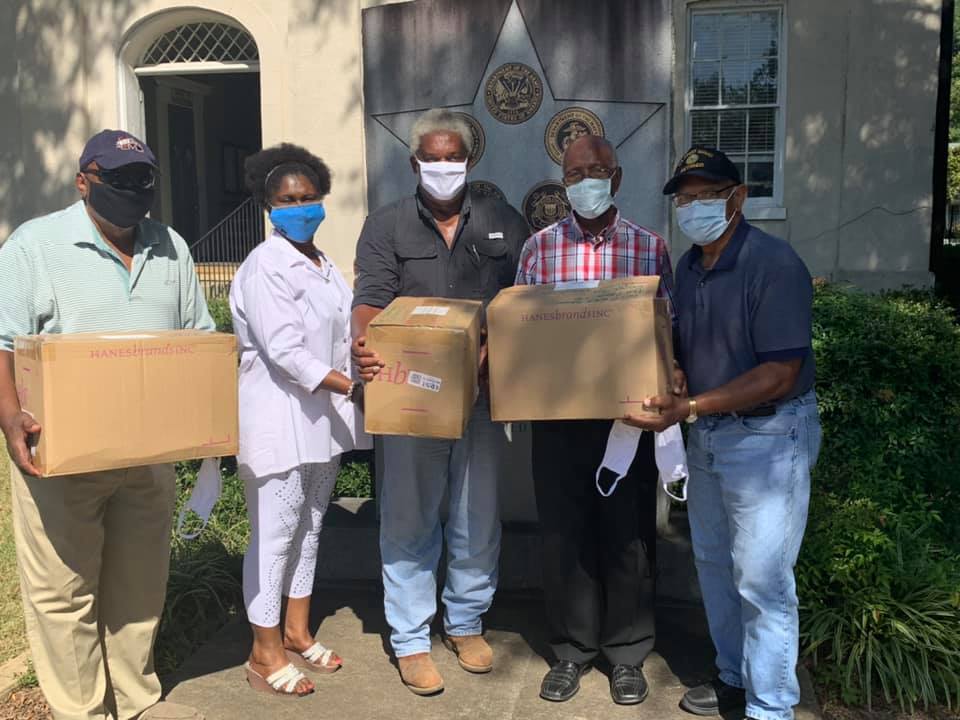 Community Health Advisors met with Freddie White-Johnson, second from left, at the Carroll County Courthouse this week to distribute free masks. 