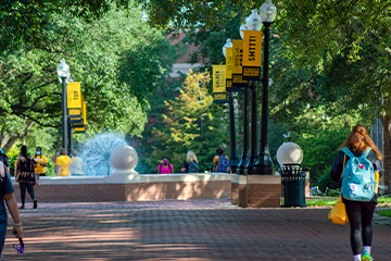 Students walking along Shoemaker Square on the USM Campus