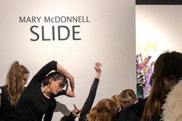 Photo of Mary McDonell Slide Exhibit and Dancers for Revelry 2020