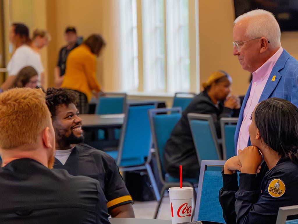 Dr. Joe Paul talking to students