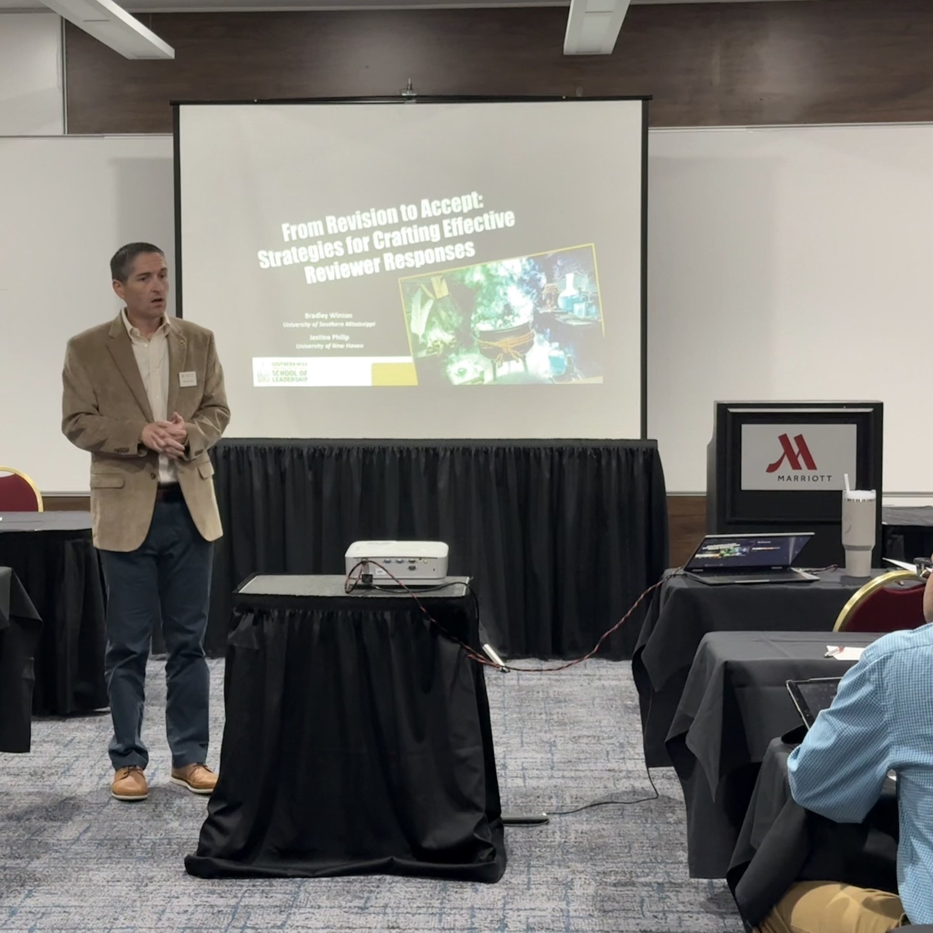 Photo of Bradley Winton Presenting at a Conference