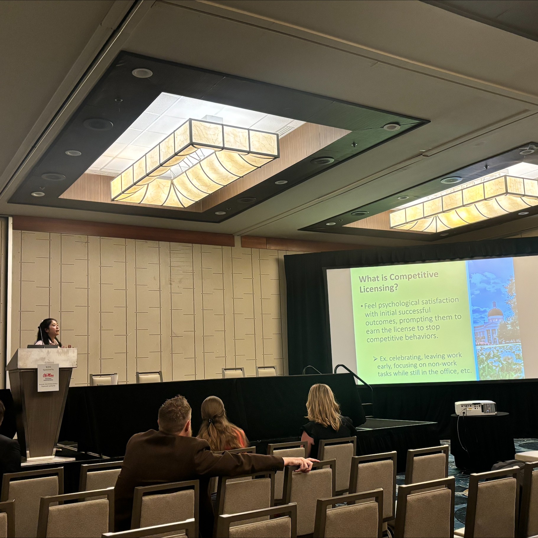 Photo of Yuting Hou Presenting at a Conference Photo of Yuting Hou Presenting at a Conference