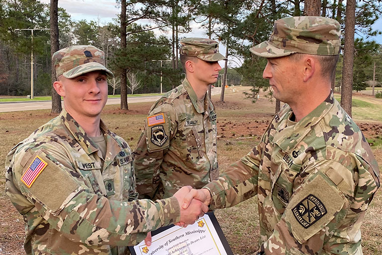 Photo of Army ROTC Cadet being honored