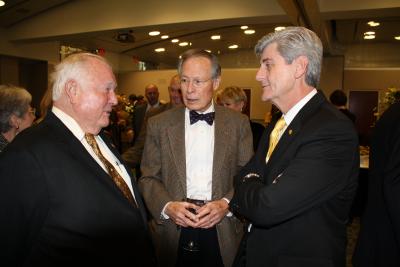 Governor-elect Phil Bryant, right, talks with Southern Miss President Emeritus Aubrey Lucas, center, and former Hattiesburg mayor Bobby Chain during a reception Thursday at the Trent Lott Center, where Bryant was honored with the announcement of the creation of the Phil Bryant Executive Leadership Scholarship. 