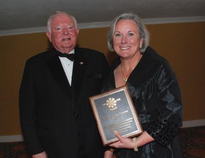 Southern Miss President Martha Saunders is presented the Hub Award by former Hattiesburg mayor Bobby Chain.