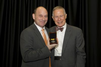 Jon Scieszka, left, receives the Southern MIss Medallion from President Emeritus Dr. Aubrey Lucas at the 2013 Fay B. Kaigler Children's Book Festival.