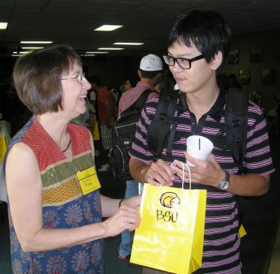 Kathy Pope welcomes new Southern Miss international exchange student Chen-Wei Chang of Taiwan to the Hattiesburg campus Friday during fall orientation.