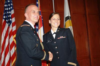 Erin Paige White Rapp, right, is congratulated by Lt. Col. Joseph Worley Jr. of the Southern Miss Department of Military Science following her commissioning as a second lieutenant in the U.S. Army.