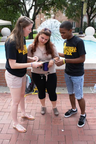 Freshman Megan Ratcliff, center, gets help with directions on the Southern Miss Hattiesburg campus from sophomores Maegan Daniels, left, and Daniel Fontenette.