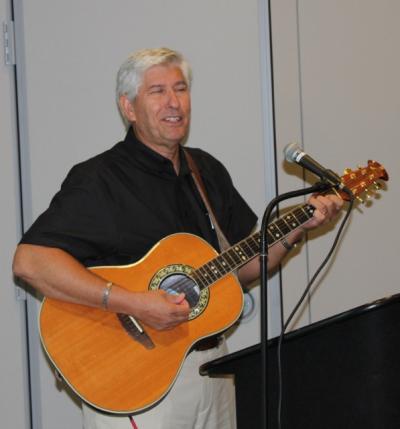 Charles Scribers, an alumnus of the University of Southern Mississippi's Summer Program in Graduate Education, plays guitar during a reunion of the program's former students July 20-22 on the Hattiesburg campus. (Photo by Dr. Willie Pierce)