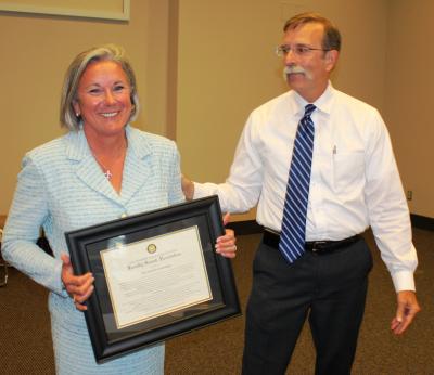 Southern Miss President Martha Saunders recieves a proclamation from the university's faculty senate honoring her service to the university from faculty senate president Tim Rehner.