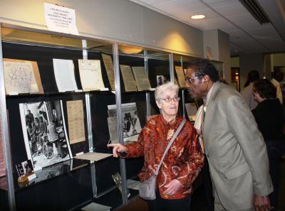Sue Sojourner and Robert Clark view the exhibit 'The Holmes County Civil Rights Movement, 1964-1969" in the Cook Library lobby at Southern Miss.