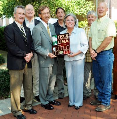 Southern Miss President Martha Saunders and members of the campus Tree Management Task Force celebrate the university's Tree Campus USA designation by the Arbor Foundation during a ceremony Tuesday on the Hattiesburg campus.