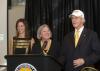 Caroline Johnson, left, USM President Martha Saunders and Ellis Johnson.