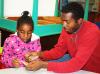 Ryan Parker helps Cassidy Crosby with an arts and crafts project at Aldersgate.