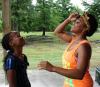 Southern Miss student Ha'gar Simpson, right, volunteers at a local summer camp.