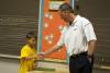 Coach Todd Monken, right, greets student Ryan Damico, 9, of Hattiesburg.