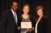 Dr. Jennifer Walker, center, receives the Oustalet Teaching Award.