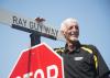 Ray Guy with street sign.