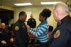 Lt. Dejeremy Thomas being pinned by his wife, Lakeshia.