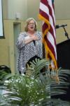 Girls State Director Angela Kilcrease pledges allegiance to the U.S. flag.