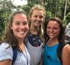 Cooper Robinson, center, in Ghana with two fellow American students .