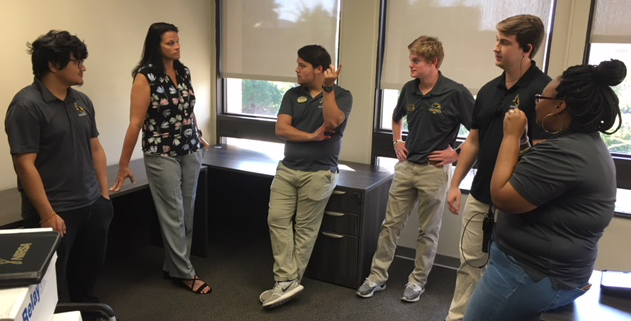 USM Associate Vice President for Student Affairs and Dean of Students Sirena Cantrell, center, talks to students during her first day of work on the Hattiesburg campus.