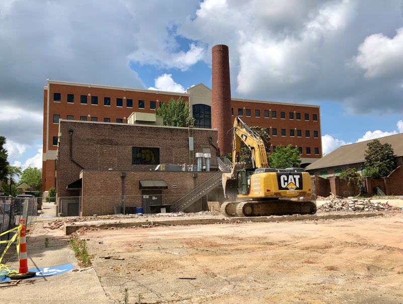 Excavator clears the area around the former Printing Center