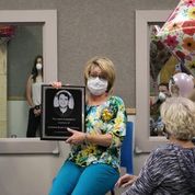 Person holding plaque