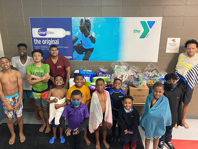 Members of the Pine Burr Area Council Boy Scout troop gathered at The Family YMCA in Hattiesburg for swimming lessons and delivering care packages they collected for the Waking Joy Project