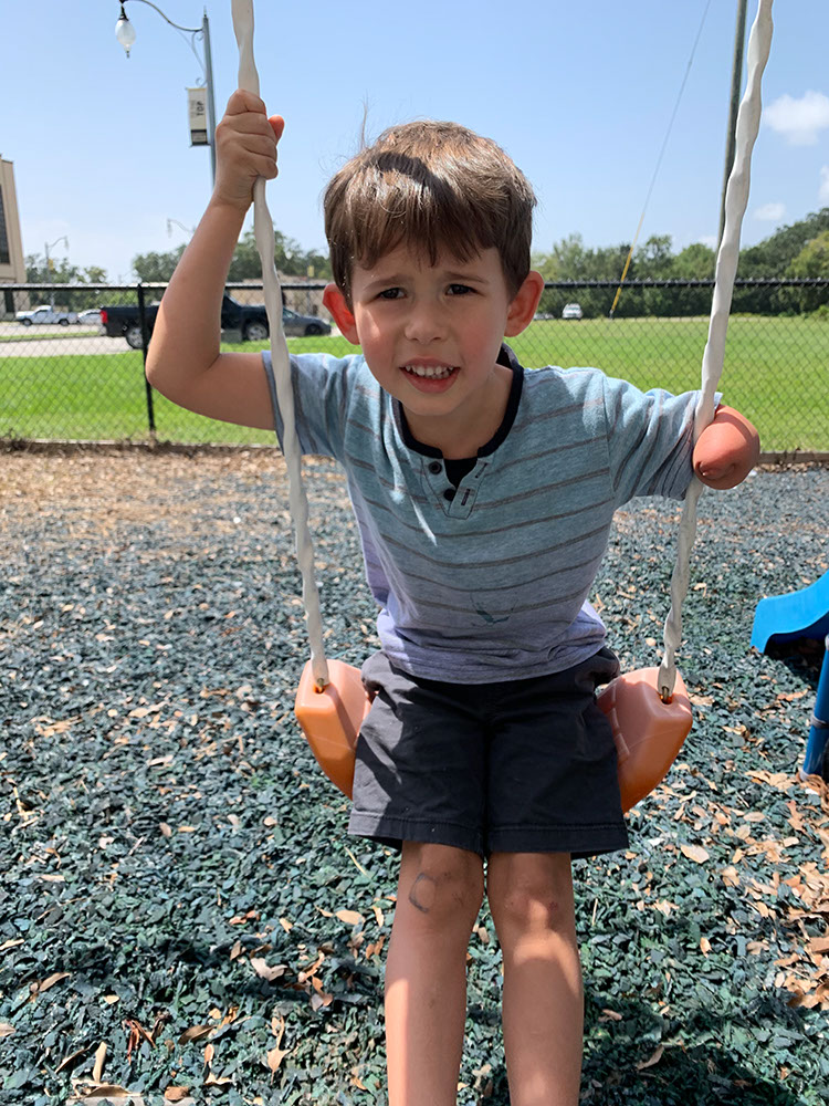 A little boy plays on the playground