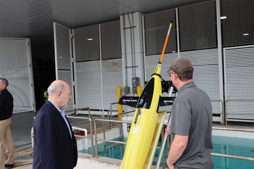 Dr. Spinrad views an uncrewed system at USM’s Marine Research Center