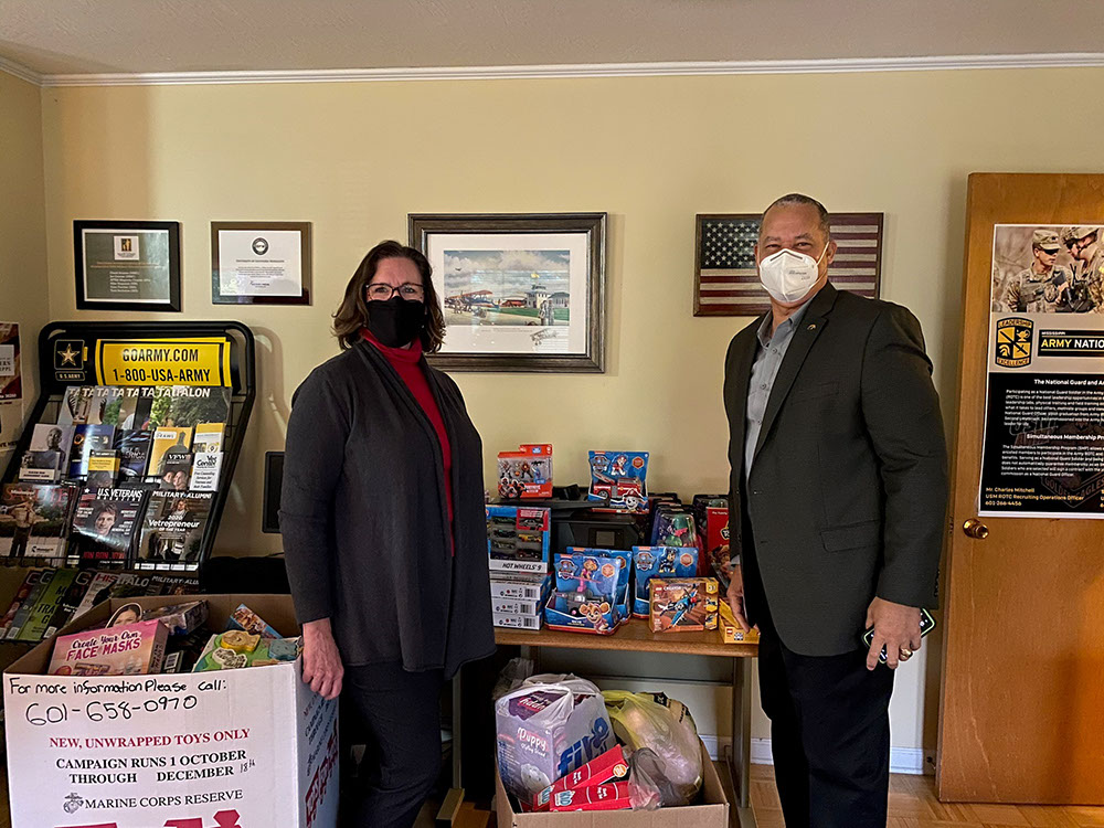 Micheal and Valerie drop off the toys to Toys for Tots