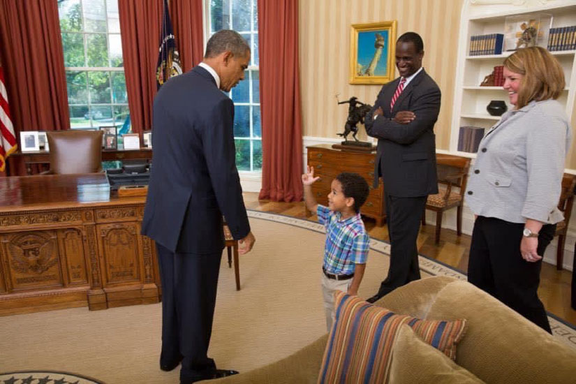 Timmy Davis, his wife, Patti, and son, Parker, meet with President Barack Obama in the Oval Office.