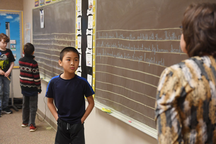 Elijah Cooper listens to instructions from a DuBard School teacher. (Photo by Kelly Dunn)
