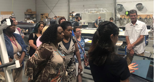 Teachers watch a demonstration of the autonomous robot Triton’s capabilities at Ocean Aero in Gulfport. Ocean Aero, a private manufacturer of uncrewed maritime systems, recently relocated to Mississippi from California. (Photo by Tara Skelton) 