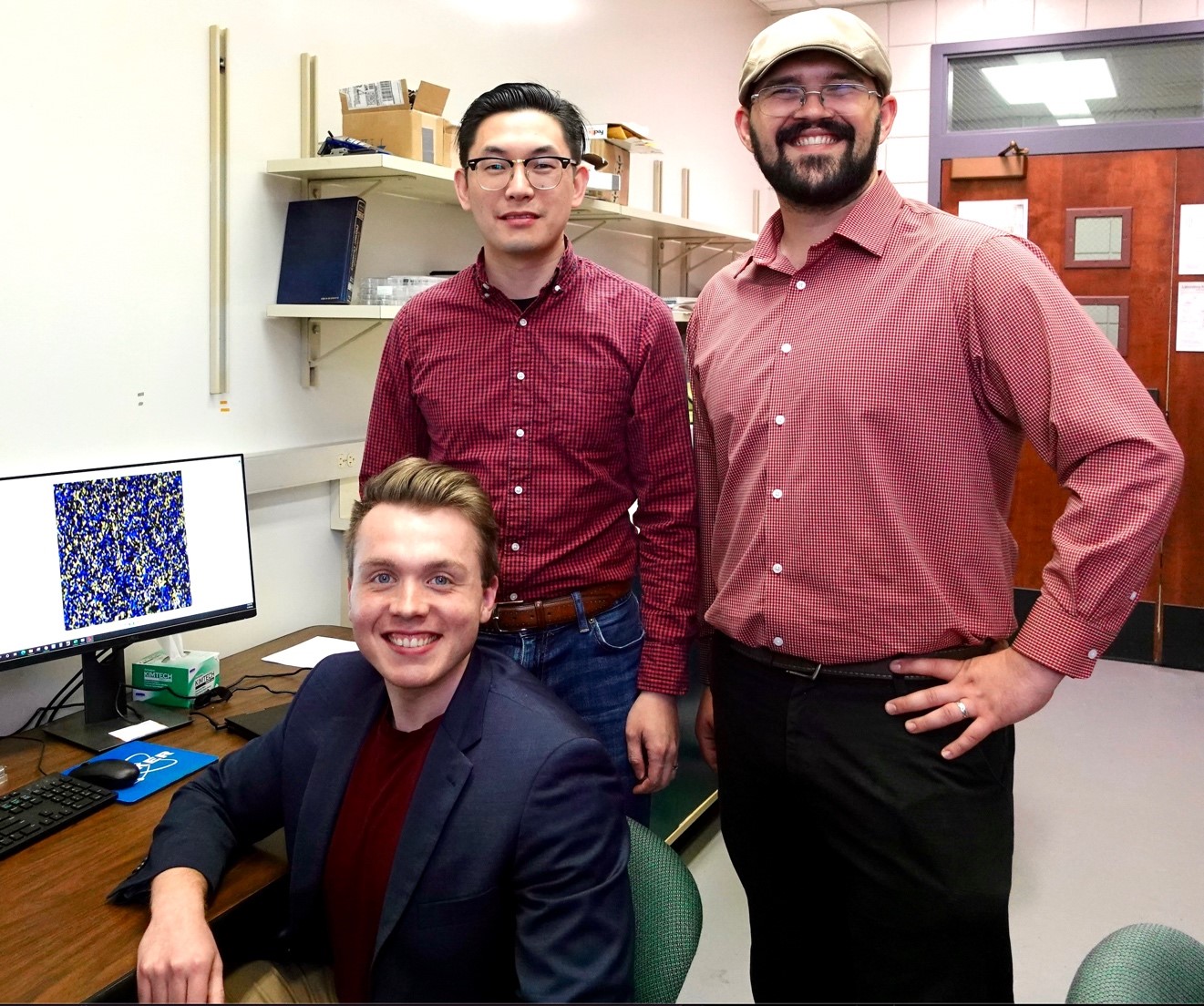 Pictured left to right: Nathaniel Prine (seated), Dr. Xiaodan Gu, and Luke Galuska.