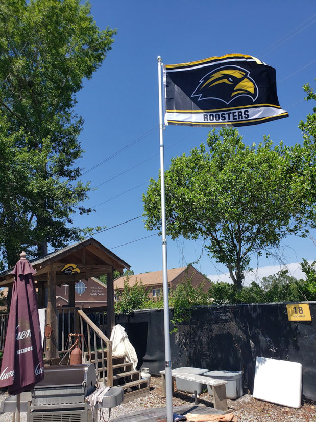 Those in the Right Field Roost have a favorite flag and nickname. (Photo courtesy of Bill Carney)