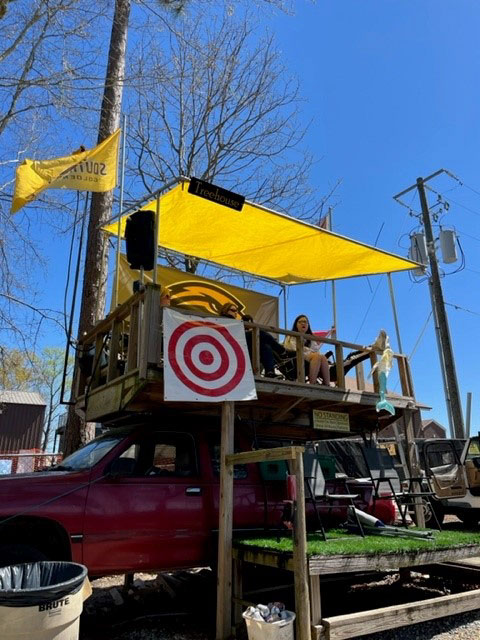 John Adams and friends have a great view from this platform atop his truck. (Photo courtesy of John Adams)