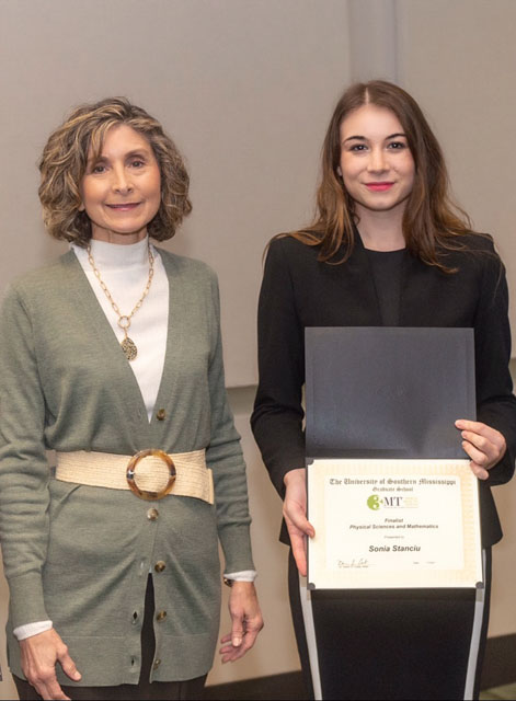 USM doctoral student Sonia Stanciu, right, and USM Associate Provost and Dean of the Graduate School Dr. Karen Coats celebrate Stanciu’s finalist award at the Conference of Southern Graduate Schools’ Three-Minute Thesis Competition. 