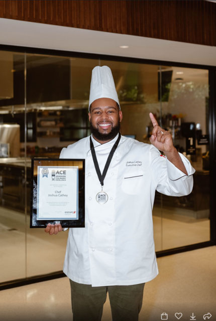 Joshua Cathey with award