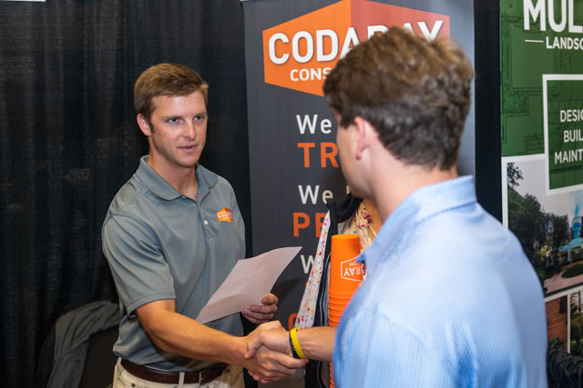 Two people shaking hands at the expo