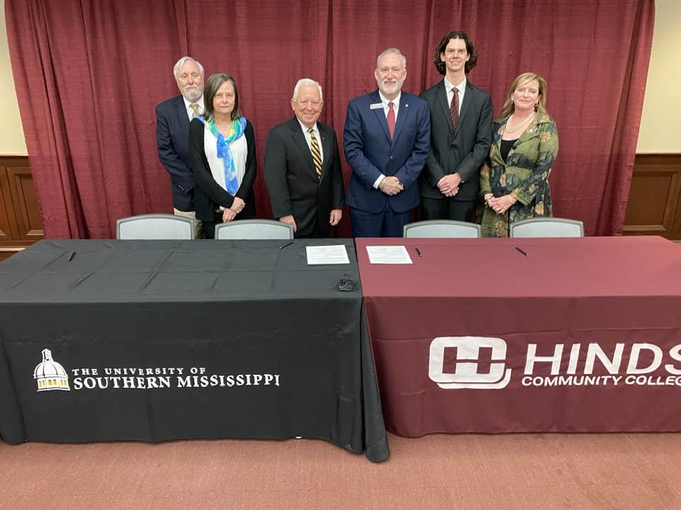 University of Southern Mississippi (USM) and Hinds Community College (HCC) officials signed an MOU (Memorandum of Understanding) Feb. 10 allowing for a seamless transfer of students enrolled in the HCC Honors Institute who transfer to the USM Honors College to complete their degree. On hand for the signing were, from left, USM Provost Dr. Gordon Cannon; USM Honors College Dean Dr. Sabine Heinhorst; USM President Dr. Joe Paul; HCC President Dr. Stephen Vacik; Honors Institute Dean Tim Krason, and Joy Rhoades, director of the HCC Honors Program at its Rankin campus (USM photo by David Tisdale).  