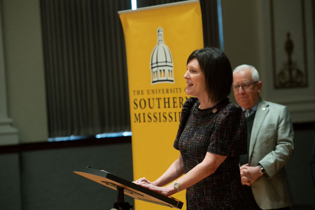 State Rep. Missy McGee of Hattiesburg, a USM alumna, gives details about a grant from the Mississippi Department of Archives and History during a press conference at Bennett Auditorium on the USM Hattiesburg campus as USM President Dr. Joe Paul looks on. The grant will fund improvements to the historic campus icon that was completed in 1930. (USM photos by Kelly Dunn)
