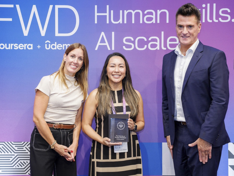Dr. Joanne Tran accepts Coursera award