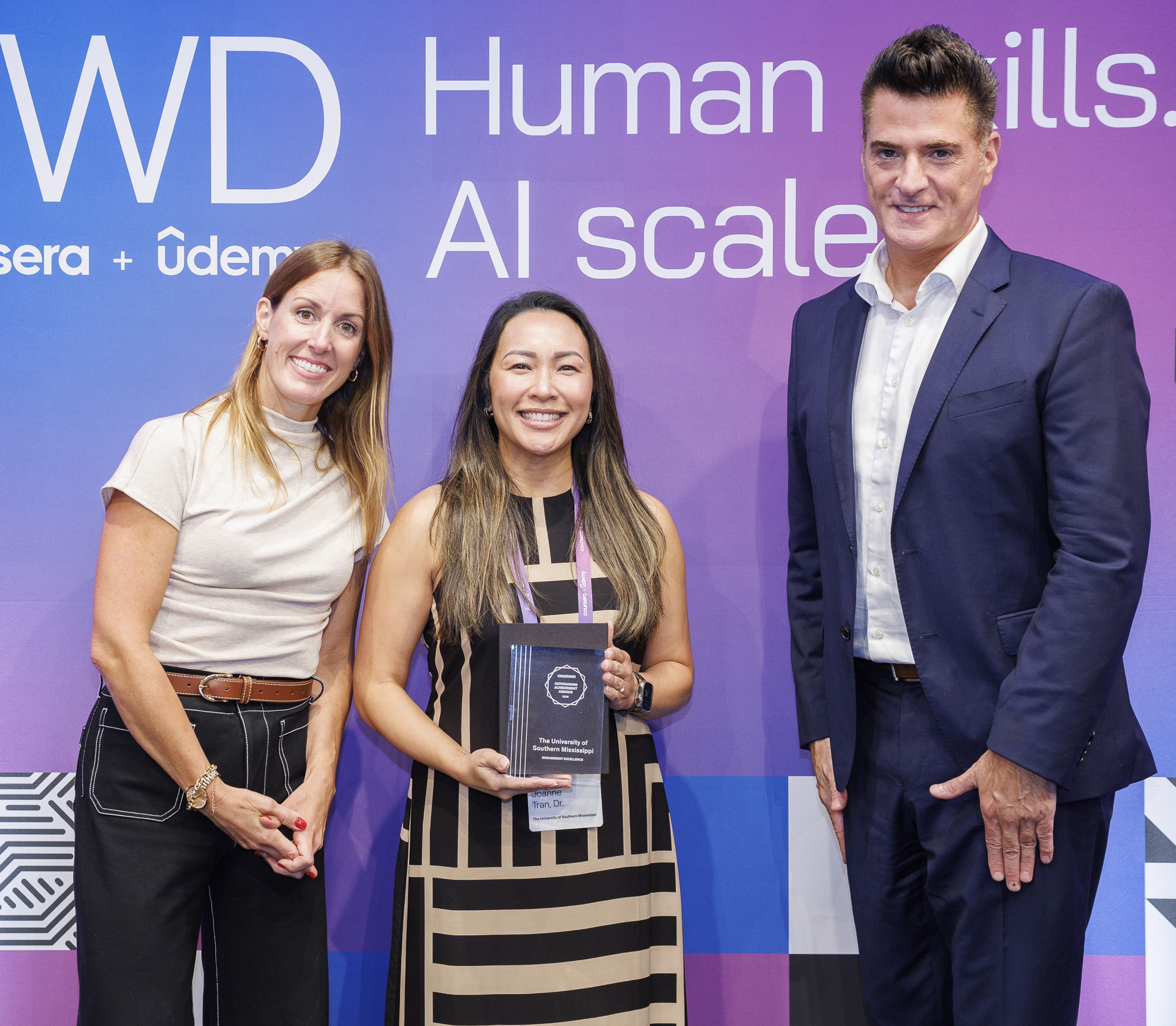 Dr. Tran accepts Coursera award