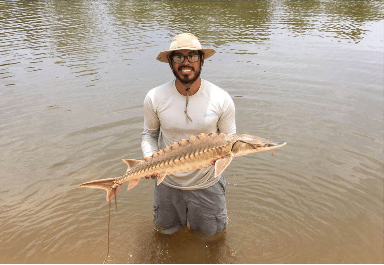 Photo of Alfonso Cohuo holding fish