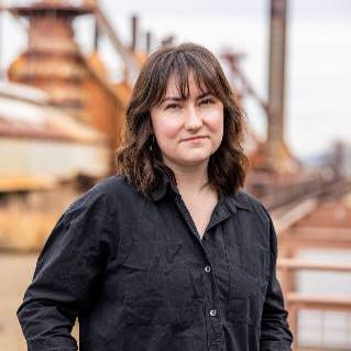 Woman posing for photo in black shirt