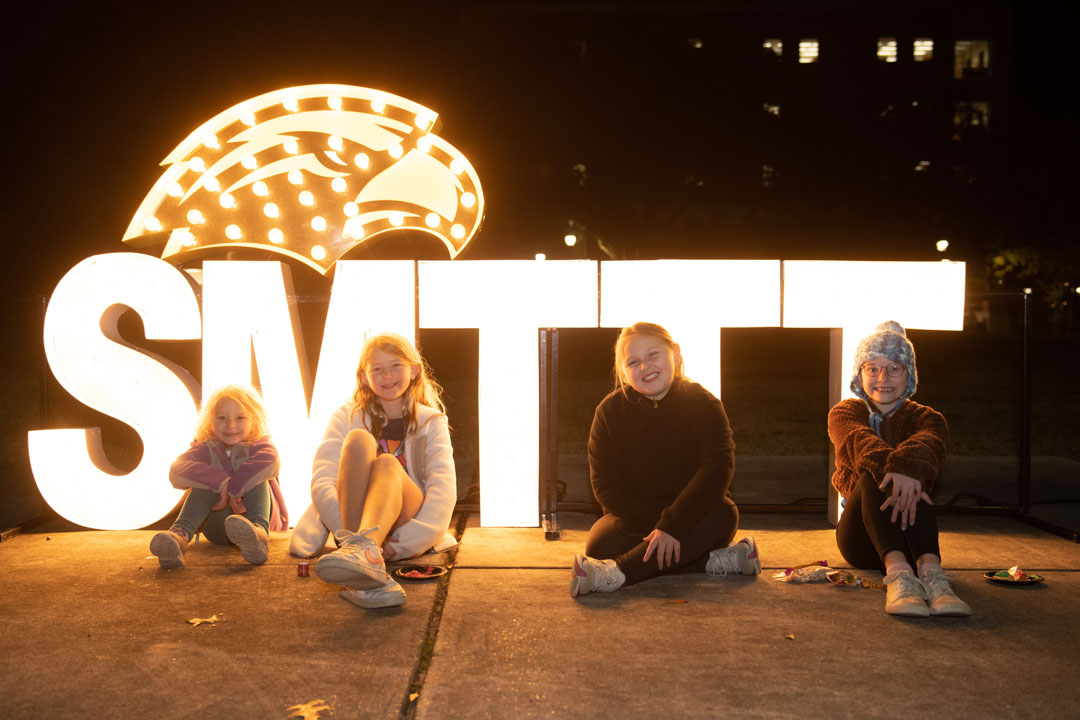 Children pose with SMTTT lights / Photo by Kelly Dunn